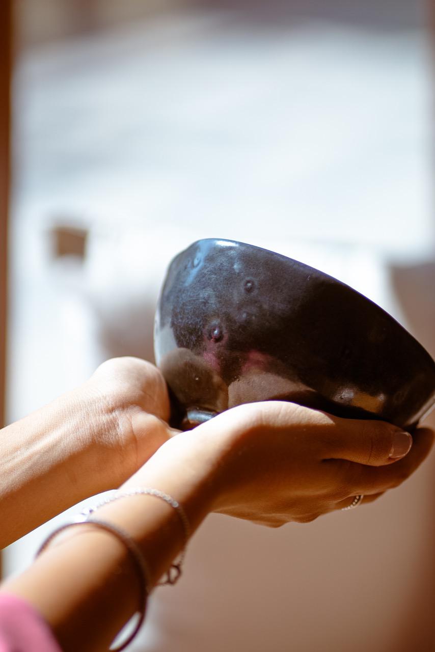 Women's Hands Holding a Handmade Pottery Perfectly Imperfect Bowl